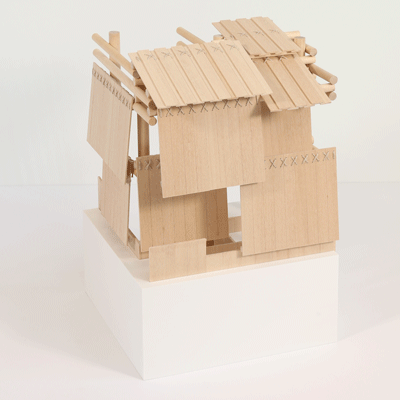 Image of basswood model combining traditional plank house with column grid